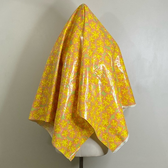 100% COTTON BASE FABRIC WITH WATERPROOFING PLASTIC OVERTOP IN A VIBRANT CITRUS - Picture 3 of 6